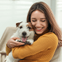 woman hugging dog